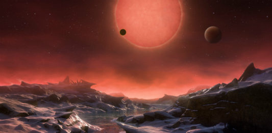 TRAPPIST-1 v představách malíře. Credit: ESO/M. Kornmesser